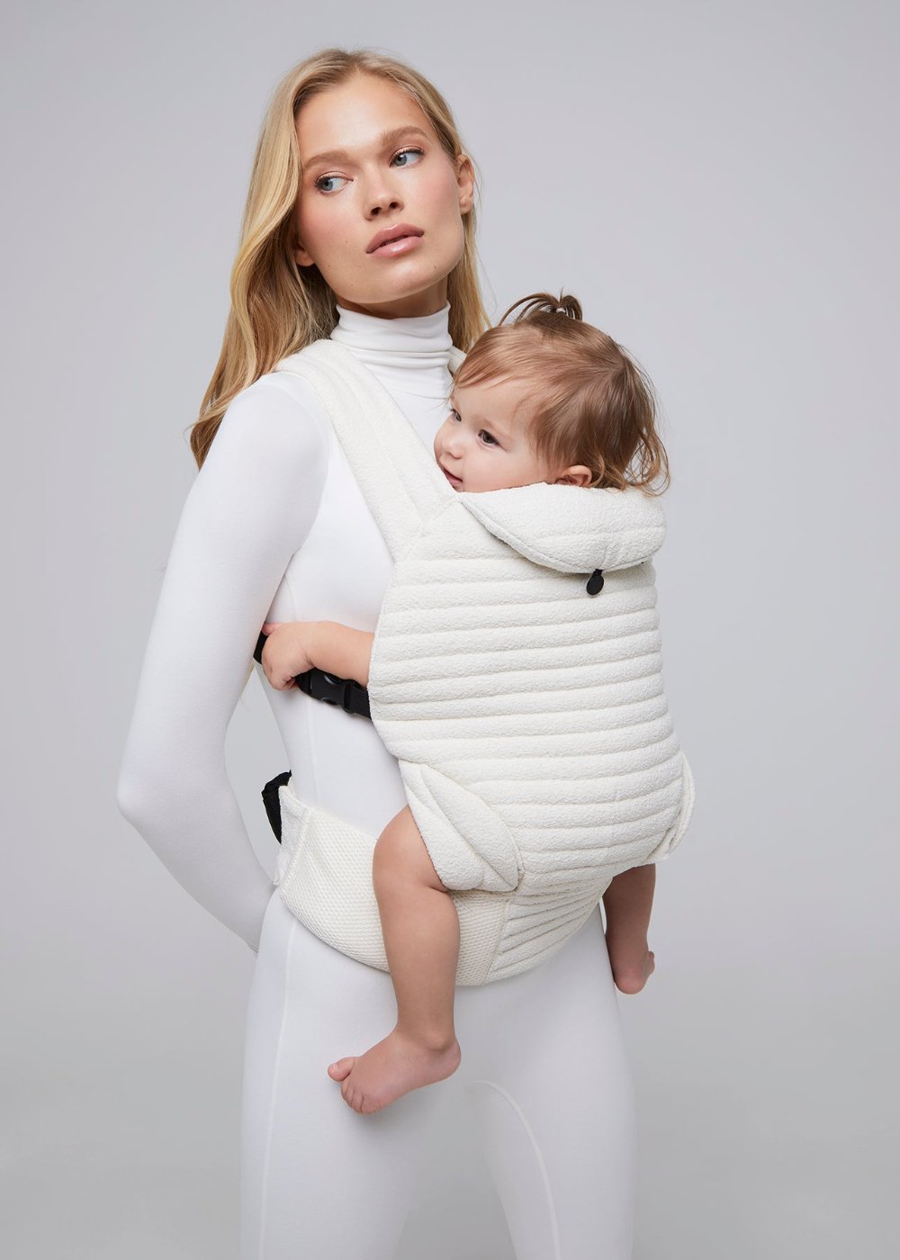 the armadillo baby carrier in cloud bumpsuit vita sidorkina