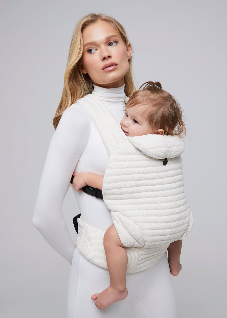 the armadillo baby carrier in cloud bumpsuit vita sidorkina