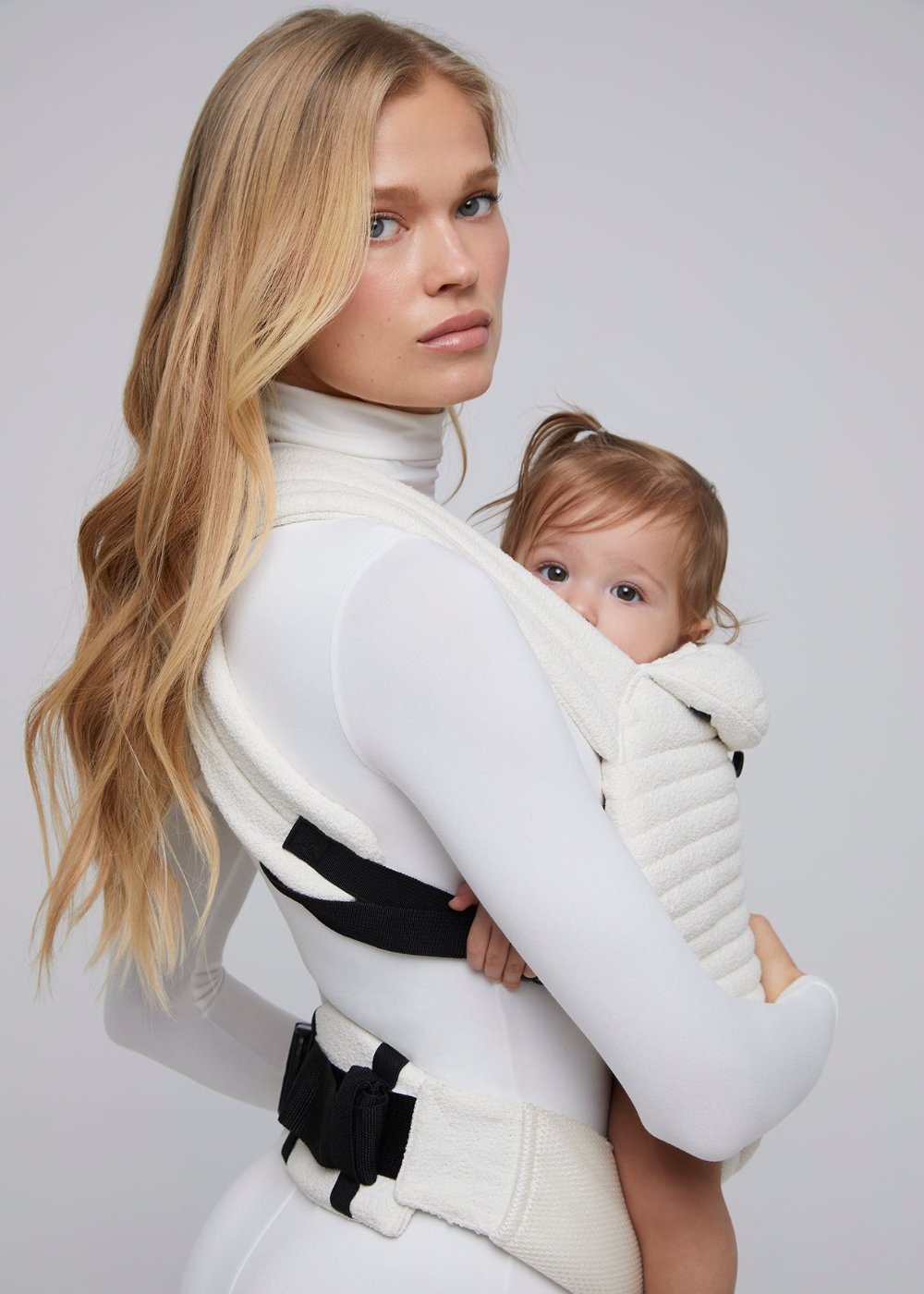 the armadillo baby carrier in cloud bumpsuit vita sidorkina