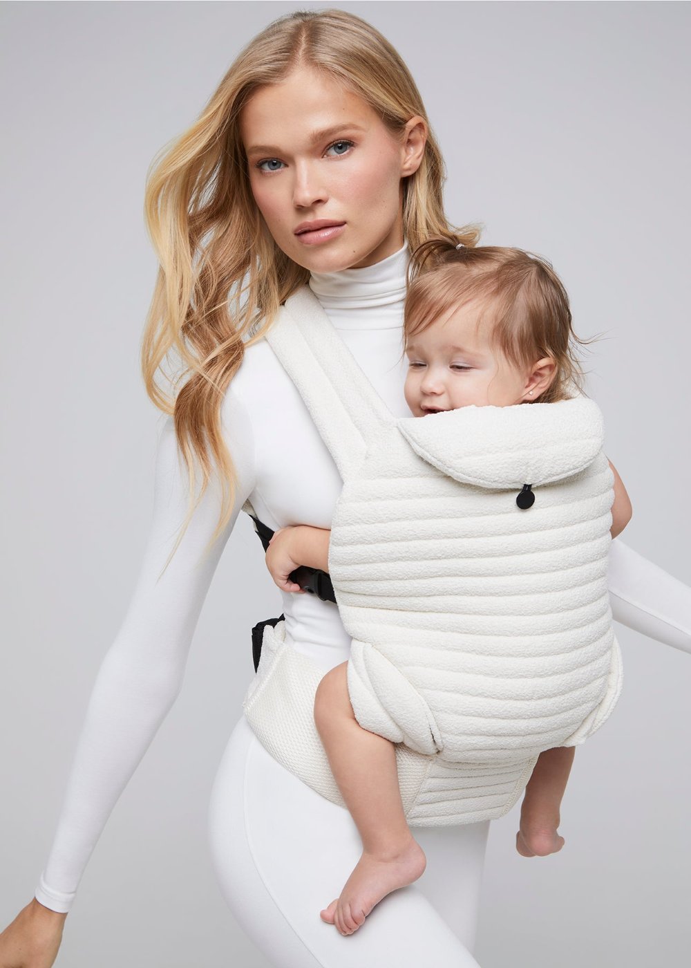 the armadillo baby carrier in cloud bumpsuit vita sidorkina