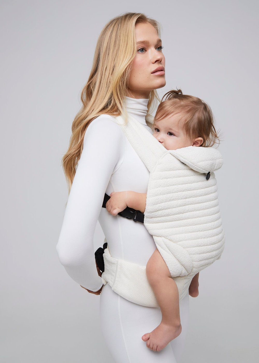 the armadillo baby carrier in cloud bumpsuit vita sidorkina