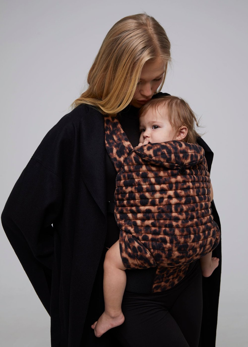 bumpsuit the armadillo baby carrier in leopard worn by vita sidorkina