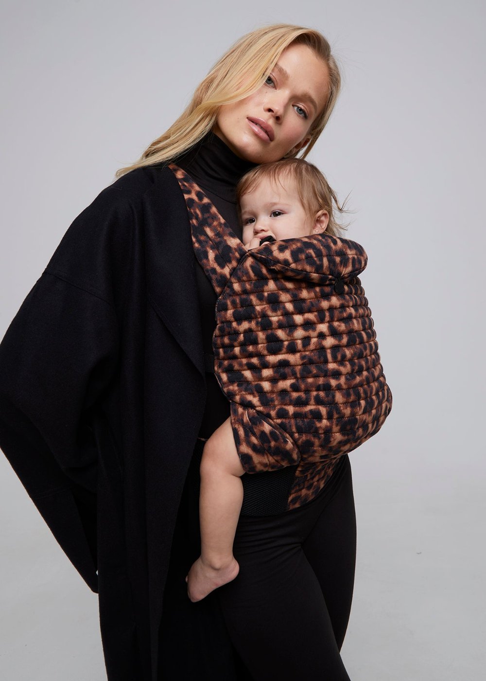 bumpsuit the armadillo baby carrier in leopard worn by vita sidorkina