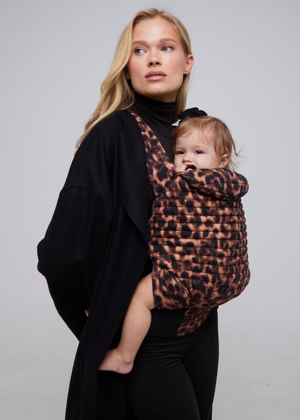 bumpsuit the armadillo baby carrier in leopard worn by vita sidorkina