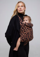 bumpsuit the armadillo baby carrier in leopard worn by vita sidorkina