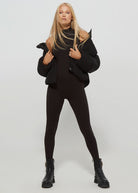 the bumpsuit maternity cropped puffer jacket in black worn by vita sidorkina