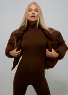 Bumpsuit Maternity Cropped Puffer Jacket in Chocolate worn by Vita Sidorkina