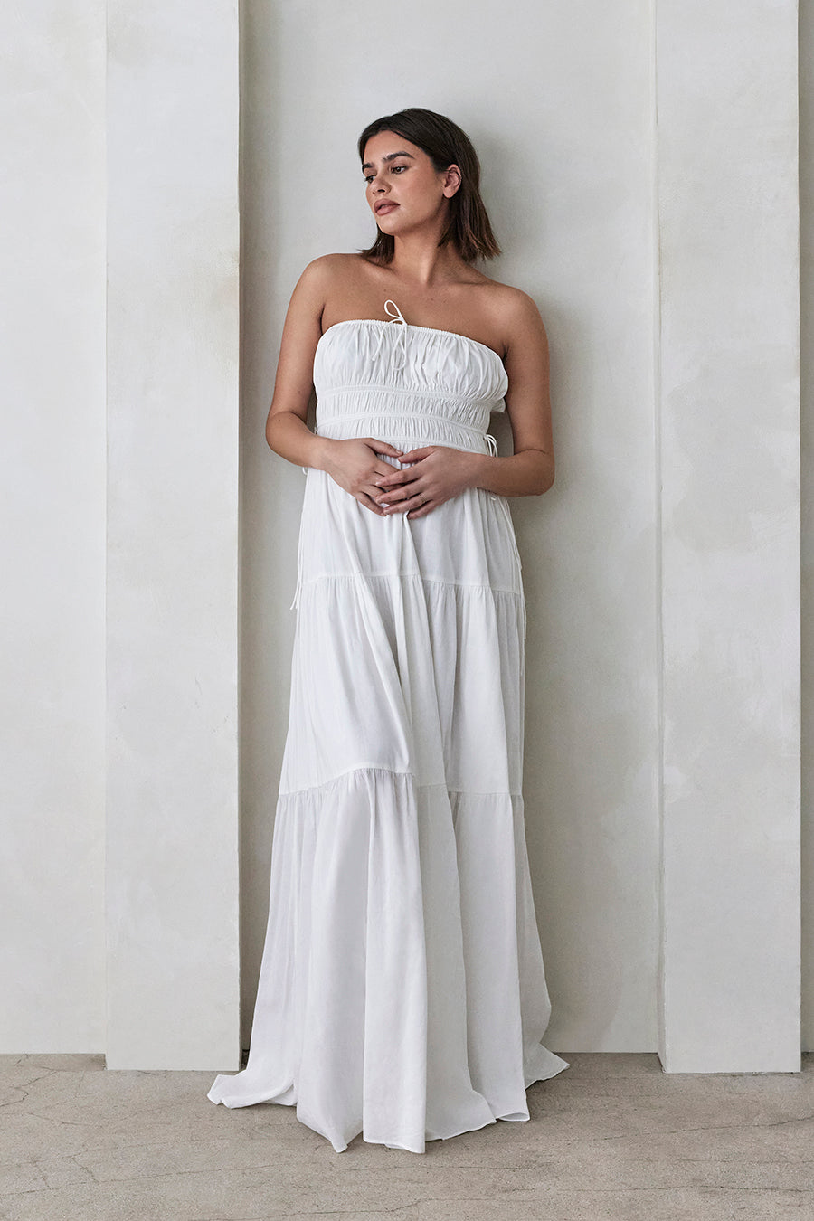 Bumpsuit Maternity Georgia Fowler the shirred strapless gown in white