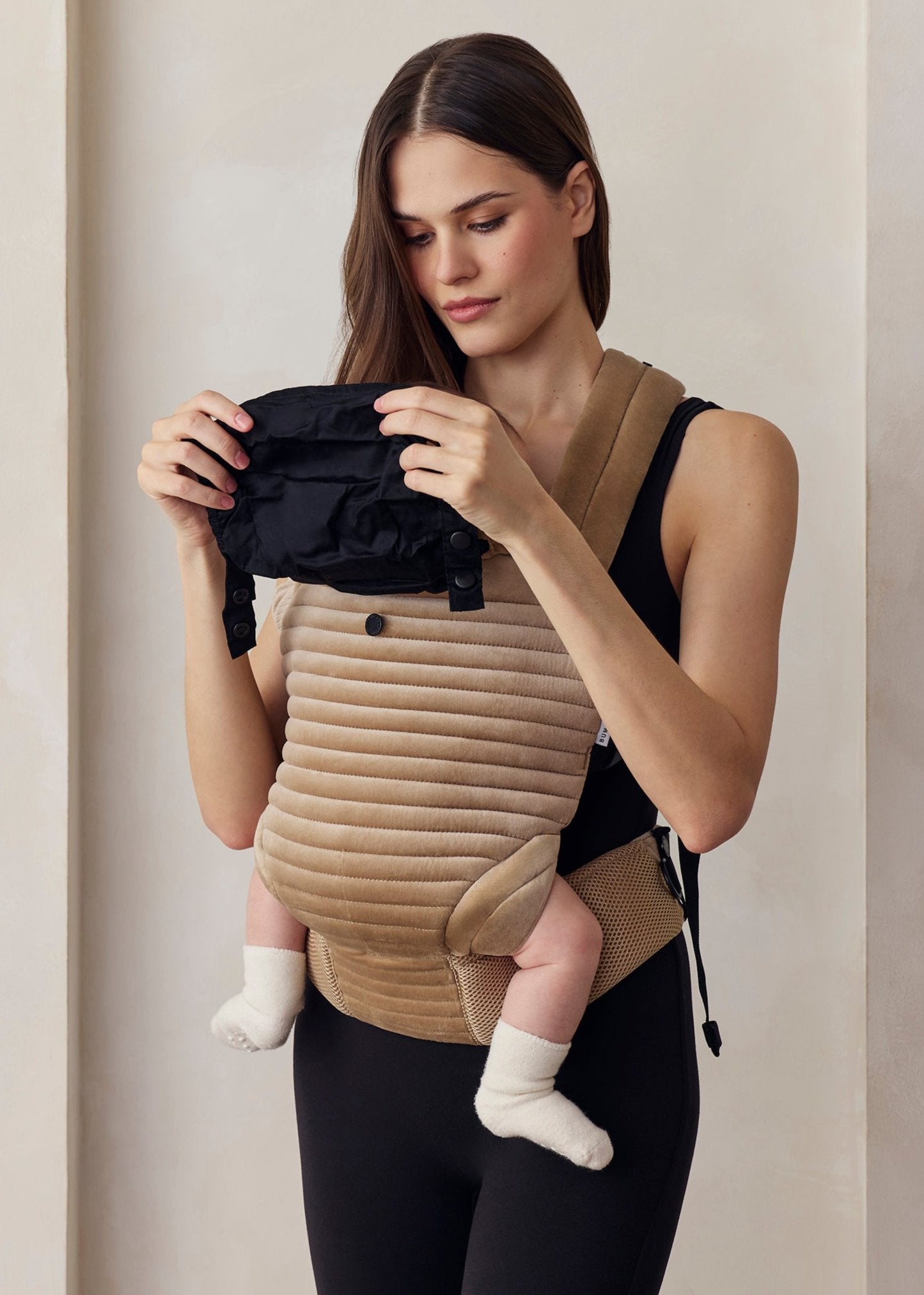 the armadillo baby carrier in dune velvet 