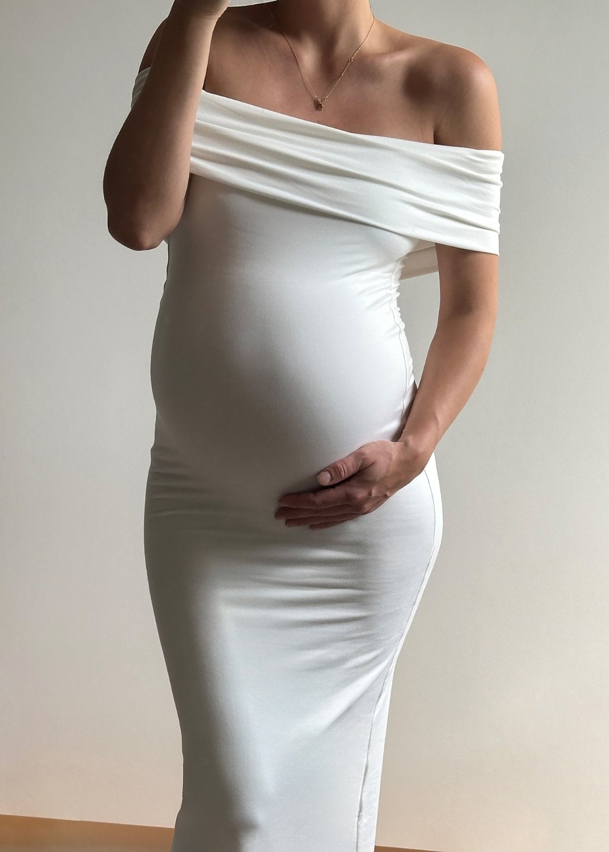 Bumpsuit Maternity The Bianca Off Shoulder Evening Dress in Ivory