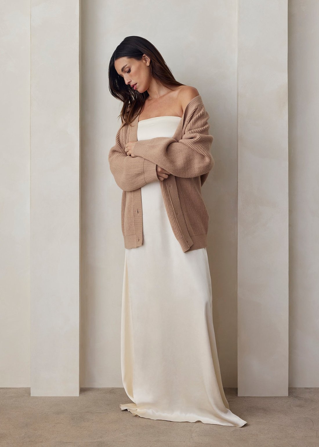 the strapless satin gown and cozy knit cardigan bumpsuit