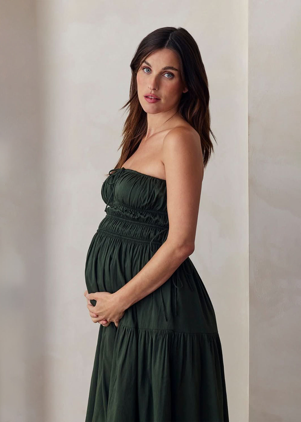 the bumpsuit maternity shirred strapless floor length gown in forest green