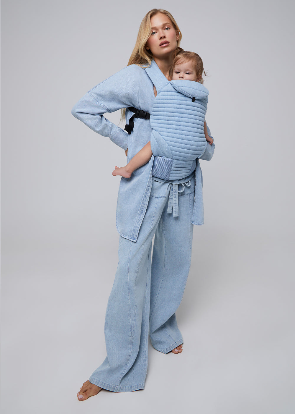 the armadillo baby carrier by bumpsuit in light denim