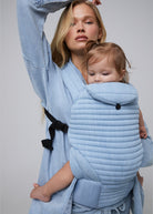 the armadillo baby carrier by bumpsuit in light denim