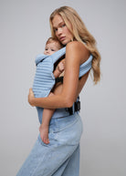 the armadillo baby carrier by bumpsuit in light denim