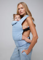 the armadillo baby carrier by bumpsuit in light denim