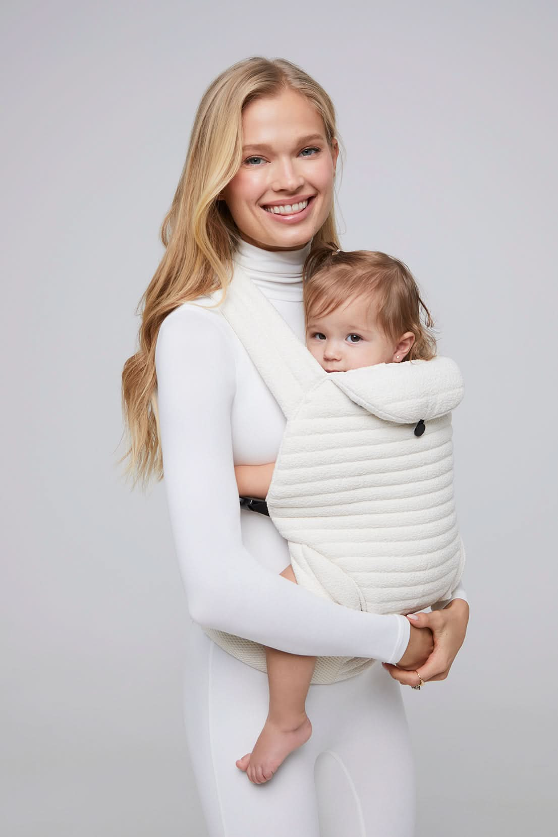 the armadillo baby carrier in cloud by bumpsuit